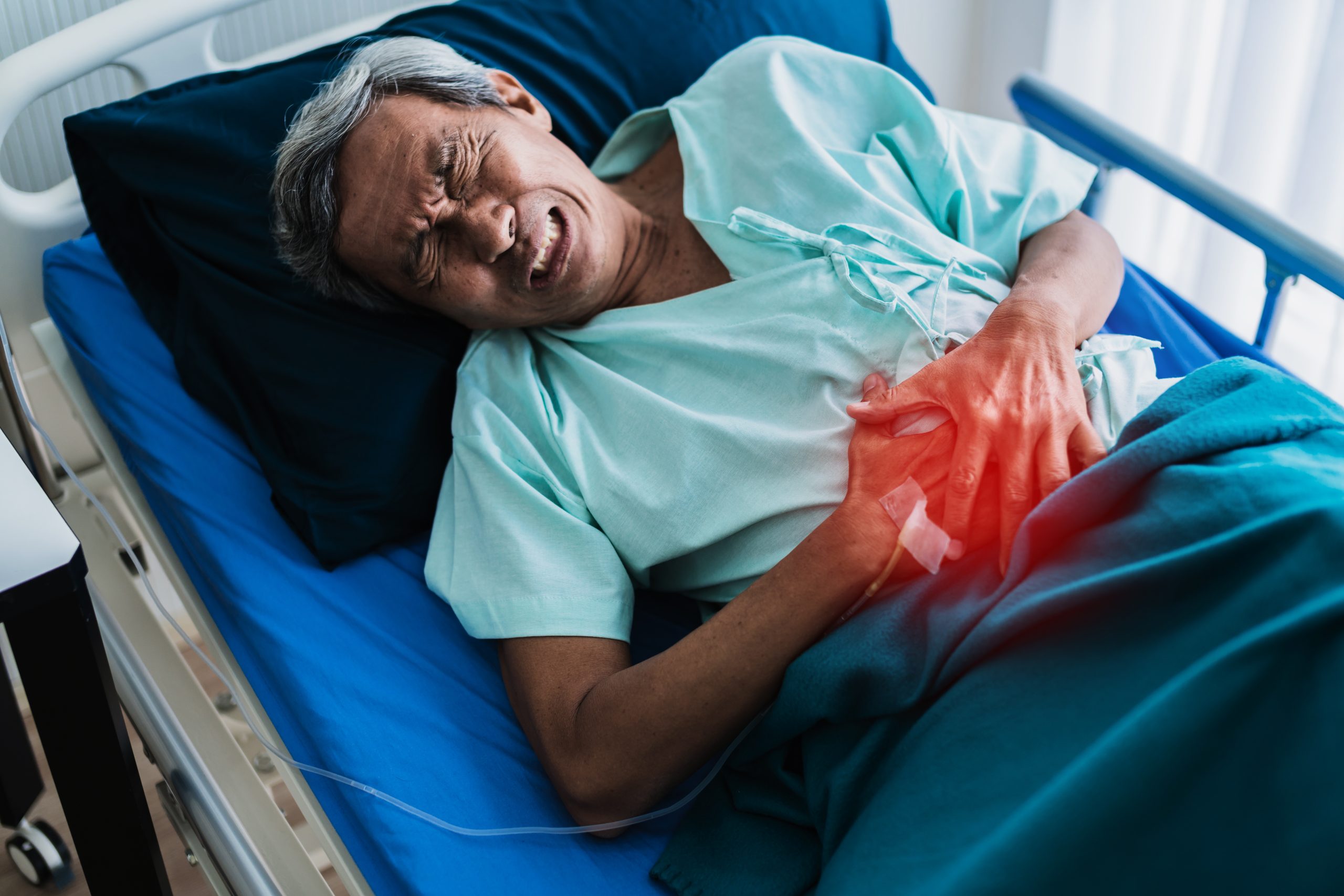 pain and stomache old senior asian grandfather in patient uniform suffer from body problem health ideas concept